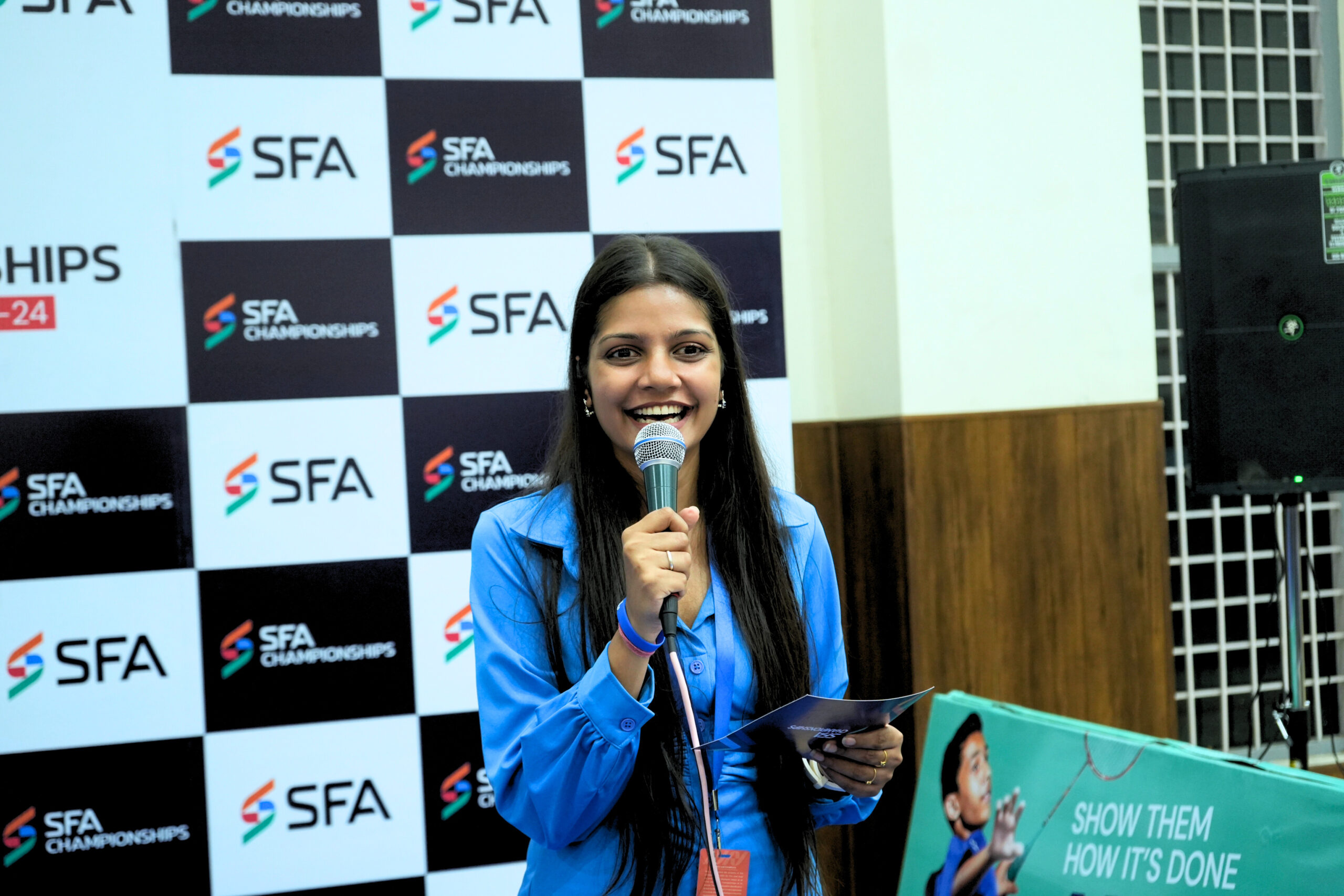 megha kedia doing announcement at an event